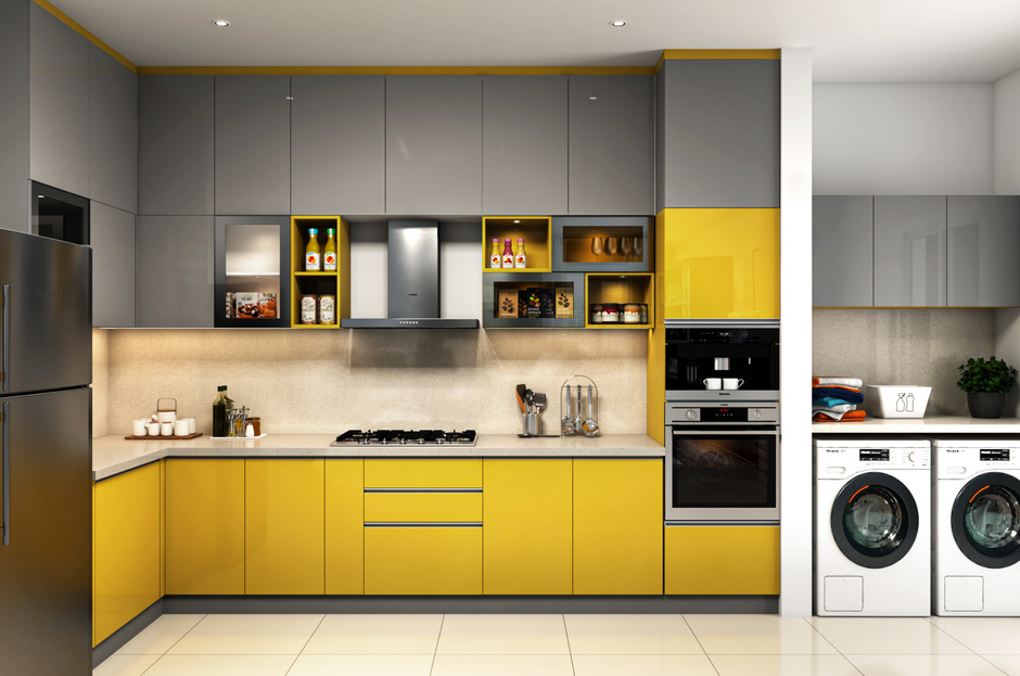 Cozinha moderna com acabamento em cores cinza e amarelo, equipada com eletrodomésticos integrados e espaço para tarefas domésticas.